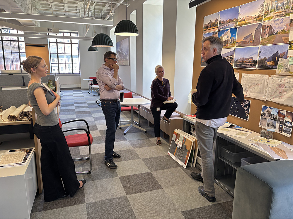 Maia Cook chatting with designers at ARC